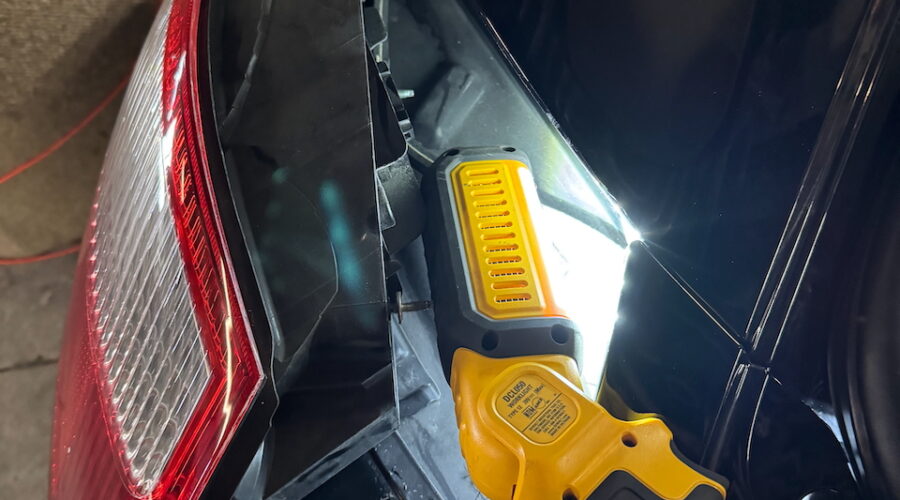 Driver side rear, tail light popped out of fixture.