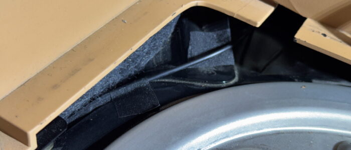 Tape down, also notice tape on the metal edge, protecting the cable from abrasion.