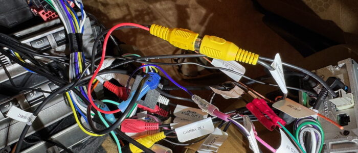 Yes! This is a mess but you can follow the red "ground" line to where I tapped the head unit's ground cable.